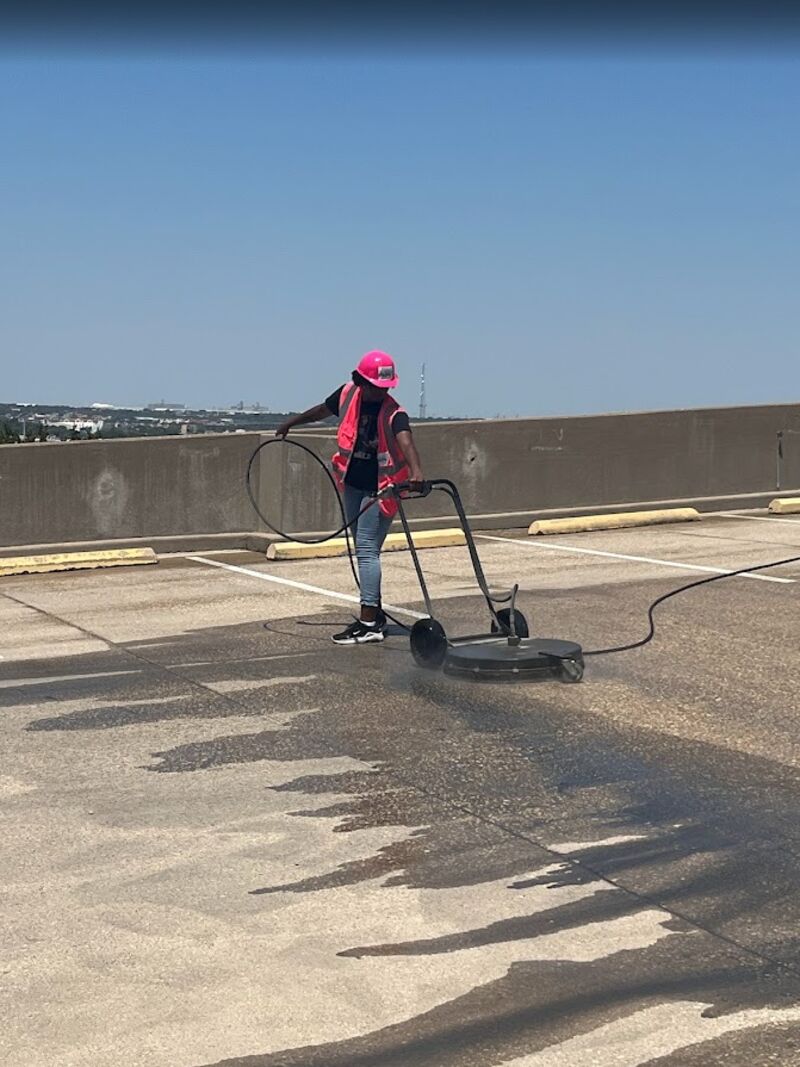 Surface cleaner leaving a clean path on a rooftop deck